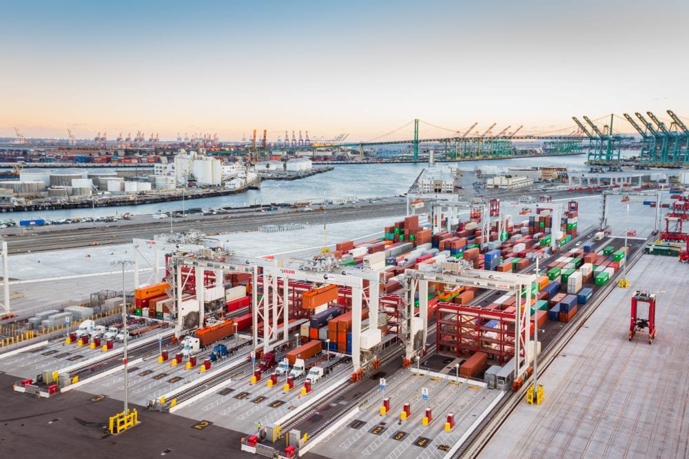 modern container terminal with large cargo ships, cranes, and digital operations center, professional photography style